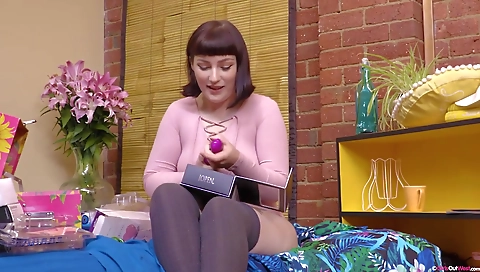 Sexy brunette fucks her boyfriend with a dildo